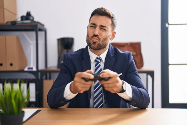 Handsome Hispanic Man Playing Video Games Office Looking Camera Blowing — Stock Photo, Image