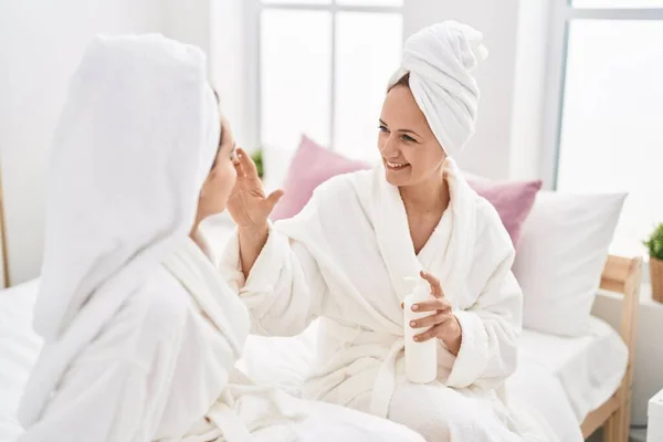 Two Women Mother Daughter Wearing Bathrobe Applying Skin Treatment Bedroom —  Fotos de Stock