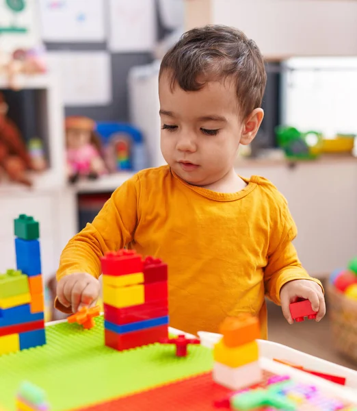 Adorable Hispanic Boy Playing Construction Blocks Standing Kindergarten — Stockfoto