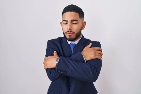 Young Hispanic Man Wearing Business Suit Tie Hugging Oneself Happy — Fotografia de Stock