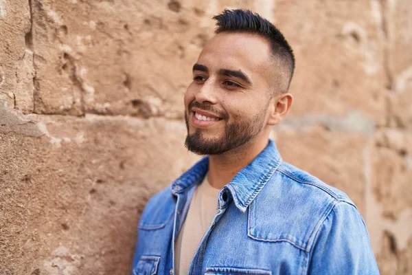 Stock image Young hispanic man smiling confident standing at street