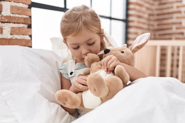 Adorable Blonde Girl Playing Doll Sitting Bed Bedroom — Stock Photo, Image