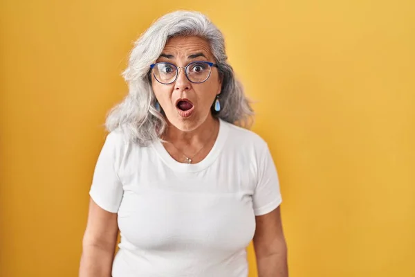 Middle Age Woman Grey Hair Standing Yellow Background Afraid Shocked — Stock Photo, Image