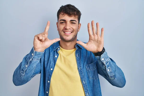 Young Hispanic Man Standing Blue Background Showing Pointing Fingers Number — Stock fotografie