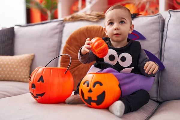 Adorable Hispanic Boy Having Halloween Party Holding Pumpkin Basket Home — Stock fotografie
