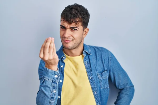 Young Hispanic Man Standing Blue Background Doing Italian Gesture Hand — Stok fotoğraf