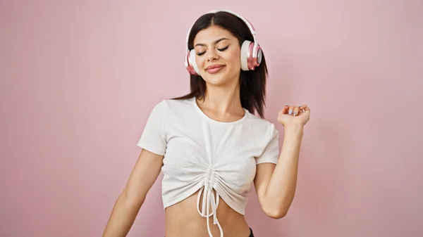 Young Caucasian Woman Listening Music Dancing Isolated Pink Background — Stock Photo, Image