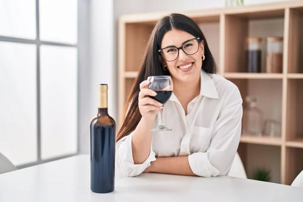 Young Hispanic Woman Drinking Glass Wine Sitting Table Home — Foto Stock