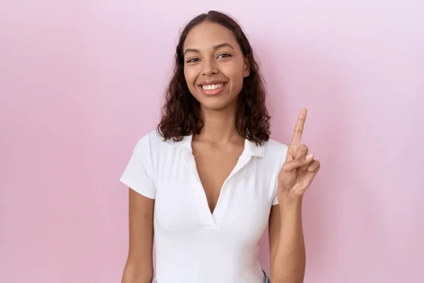 Young Hispanic Woman Wearing Casual White Shirt Showing Pointing Finger — Stock Photo, Image