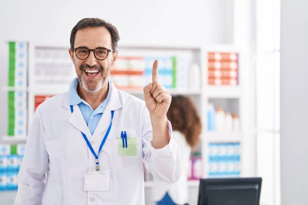 Middle Age Hispanic Man Working Pharmacy Drugstore Smiling Idea Question — Stock Photo, Image