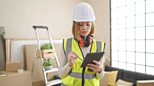 Young Blonde Woman Architect Using Touchpad Serious Expression New Home — Stock Photo, Image