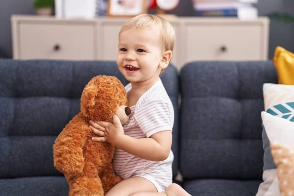 Adorable Toddler Playing Teddy Bear Sitting Sofa Home — Stock Photo, Image