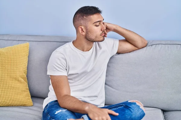 Young Hispanic Man Stressed Sitting Sofa Home — Stockfoto