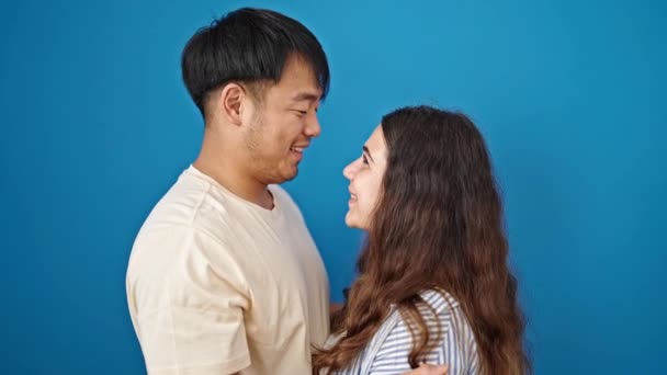 Man Woman Couple Hugging Each Other Kissing Isolated Blue Background — Stock Video