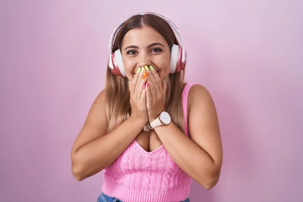 Young Blonde Woman Listening Music Using Headphones Laughing Embarrassed Giggle — Stock Photo, Image