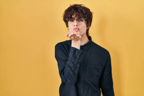 Young Man Wearing Glasses Yellow Background Looking Camera Blowing Kiss — Stock Photo, Image