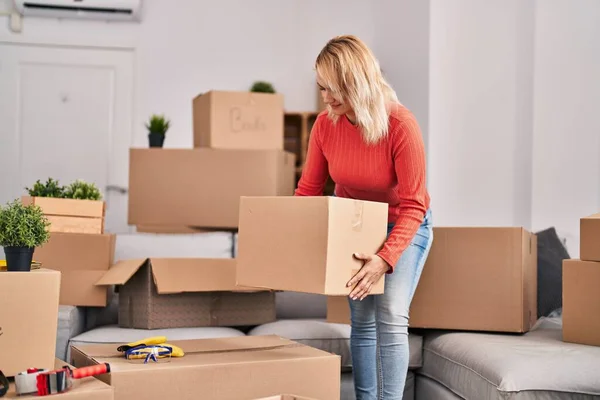 Young Blonde Woman Smiling Confident Holding Package New Home — Fotografia de Stock