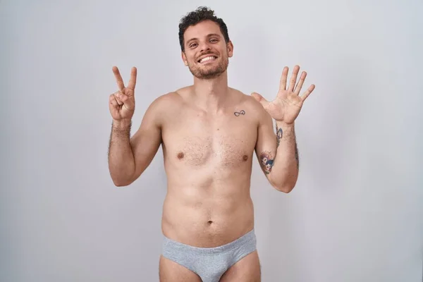 Young Hispanic Man Standing Shirtless Wearing Underware Showing Pointing Fingers — Stock Photo, Image