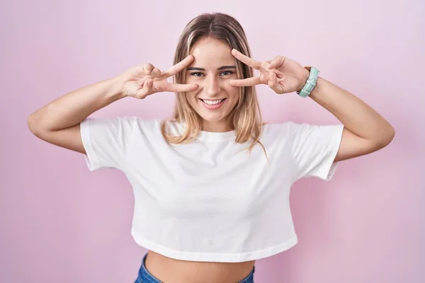 Young Blonde Woman Standing Pink Background Doing Peace Symbol Fingers — Stock Photo, Image