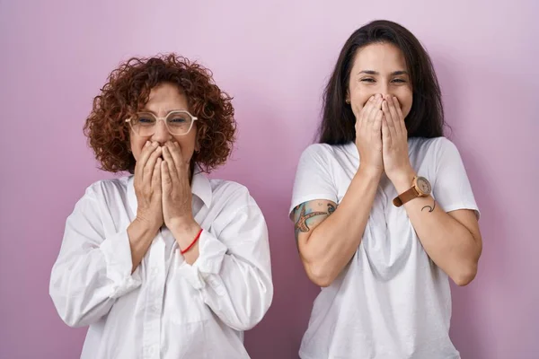 Hispanic Mother Daughter Wearing Casual White Shirt Pink Background Laughing — стоковое фото