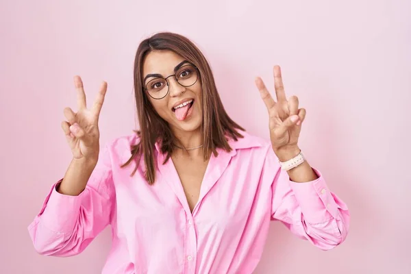 Young Hispanic Woman Wearing Glasses Standing Pink Background Smiling Tongue — Stock Photo, Image