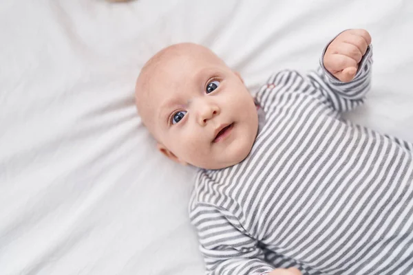 Adorable Caucasian Baby Smiling Confident Lying Bed Bedroom — Fotografia de Stock