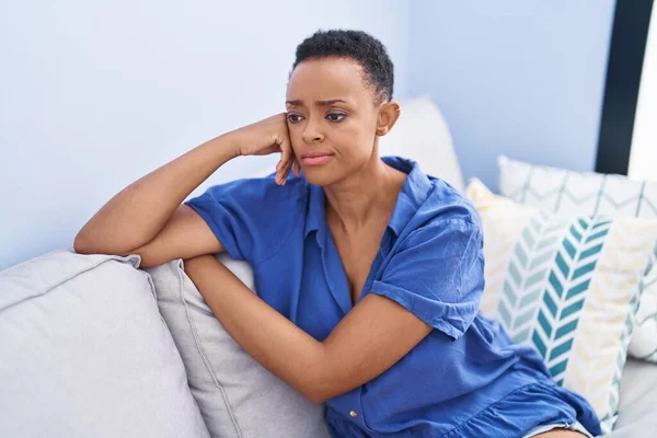 African American Woman Sitting Sofa Serious Expression Home — Stockfoto