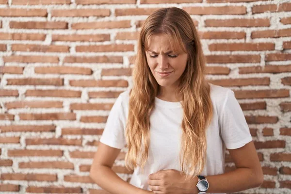 Young Caucasian Woman Standing Bricks Wall Hand Stomach Because Indigestion — Stock Photo, Image