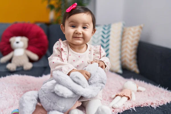 Adorable Hispanic Baby Playing Doll Sitting Sofa Home — Stock Photo, Image