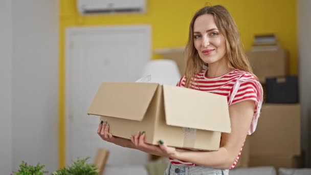 Young Blonde Woman Smiling Confident Holding Package New Home — Stock video