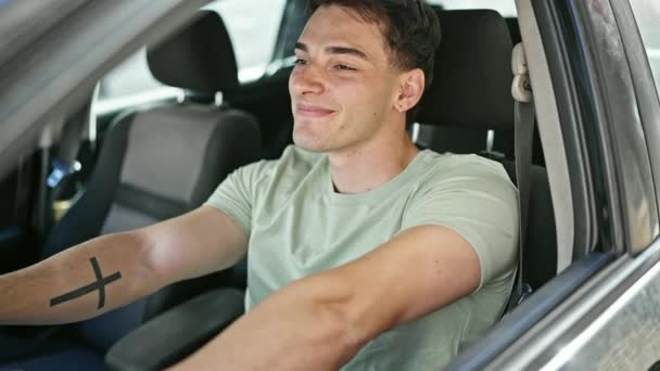 Young Hispanic Man Smiling Confident Driving Car Street — стоковое видео