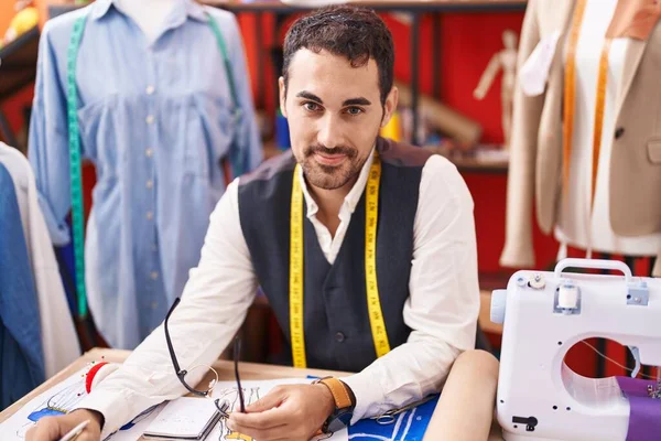 Young Hispanic Man Tailor Smiling Confident Sitting Table Atelier — Stockfoto
