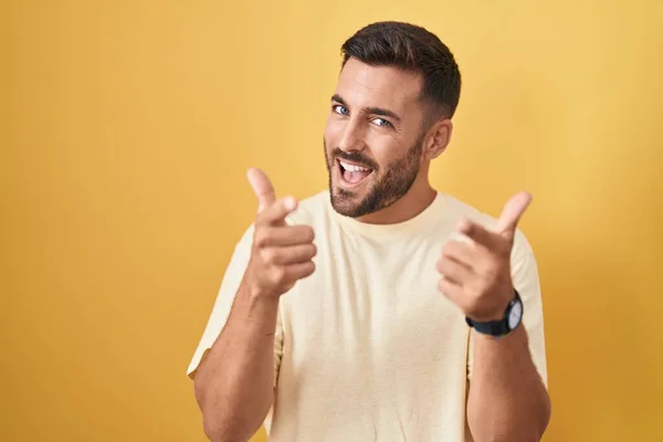 Handsome Hispanic Man Standing Yellow Background Pointing Fingers Camera Happy — Stock Photo, Image
