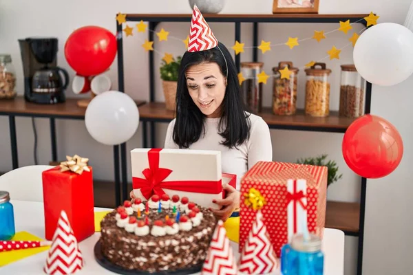 Young Caucasian Woman Opening Gift Box Celebrating Birthday Home — Stok fotoğraf