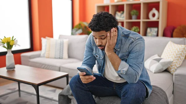 African American Man Using Smartphone Worried Expression Home — Stock Photo, Image