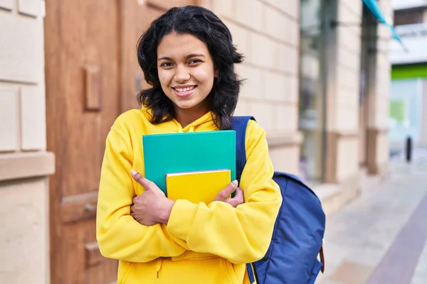 Young Latin Woman Student Smiling Confident Holding Books Street — Stock fotografie