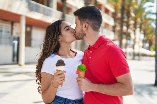 Young Hispanic Couple Tourists Hugging Each Other Eating Ice Cream — Photo