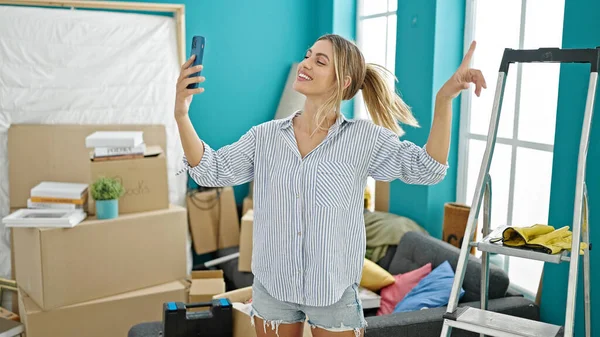 Young Blonde Woman Smiling Confident Having Video Call New Home — ストック写真