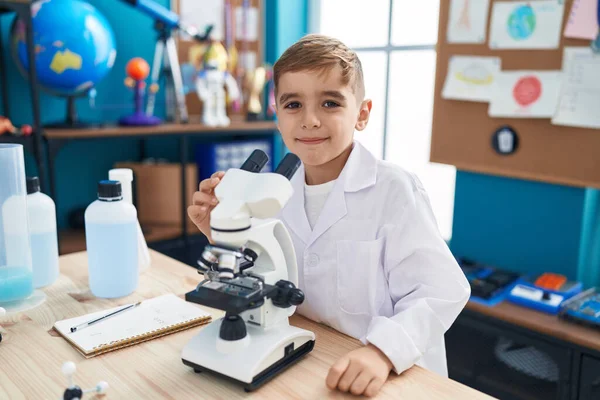 Adorable Hispanic Boy Student Smiling Confident Using Microscope Laboratory Classroom — 图库照片
