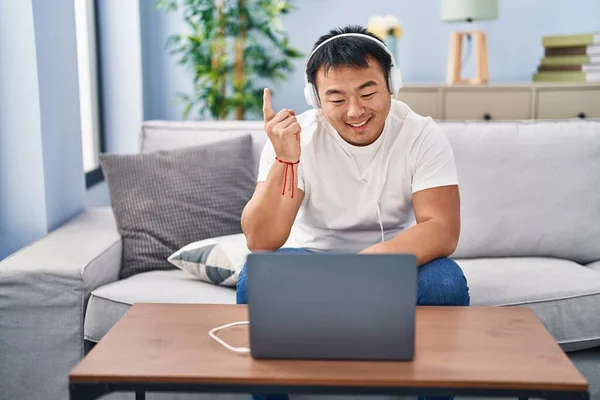 Young Chinese Man Using Laptop Home Smiling Happy Pointing Hand — Stock Photo, Image