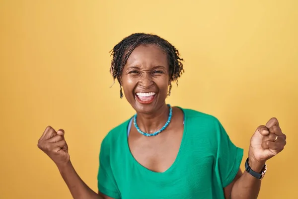 African Woman Dreadlocks Standing Yellow Background Very Happy Excited Doing — Stock Photo, Image