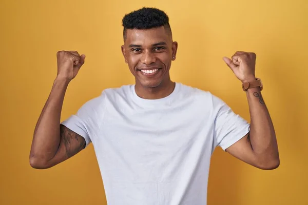 Young Hispanic Man Standing Yellow Background Celebrating Surprised Amazed Success — Fotografia de Stock
