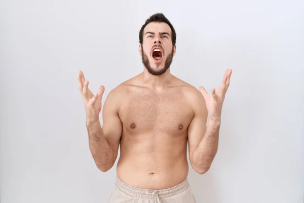Young Hispanic Man Standing Shirtless White Background Crazy Mad Shouting — Stock Photo, Image
