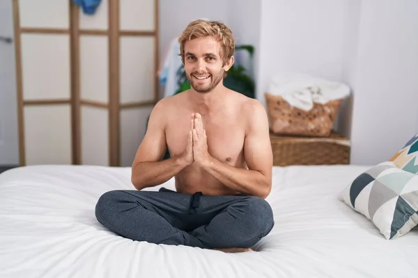 Young Man Sitting Sofa Doing Yoga Exercise Bedroom — Stock fotografie