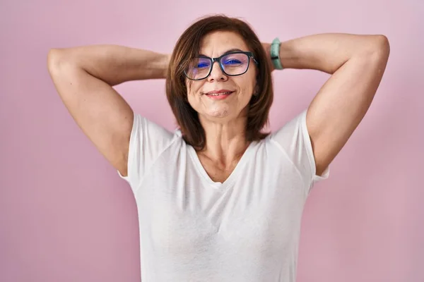 Middle Age Hispanic Woman Standing Pink Background Relaxing Stretching Arms — Stock Photo, Image
