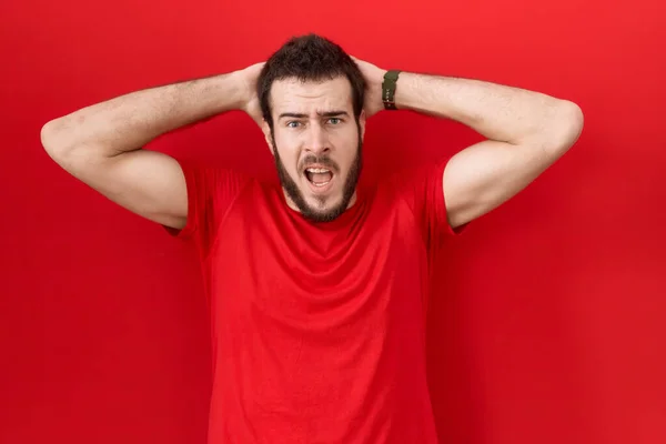 Young Hispanic Man Wearing Casual Red Shirt Crazy Scared Hands — Stock Photo, Image
