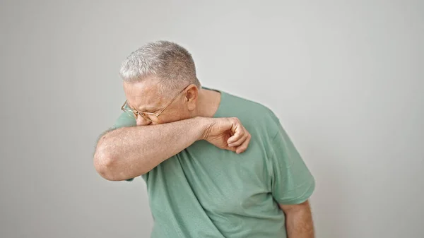 stock image Middle age grey-haired man sneezing over isolated white background