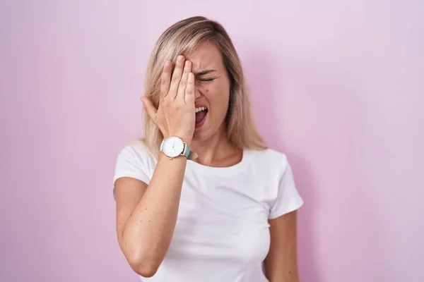 Young Blonde Woman Standing Pink Background Yawning Tired Covering Half — Stock fotografie