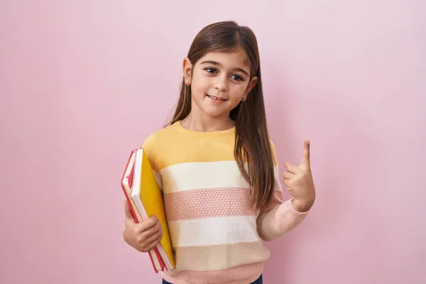 Little Hispanic Girl Holding Books Smiling Idea Question Pointing Finger — Stock Photo, Image