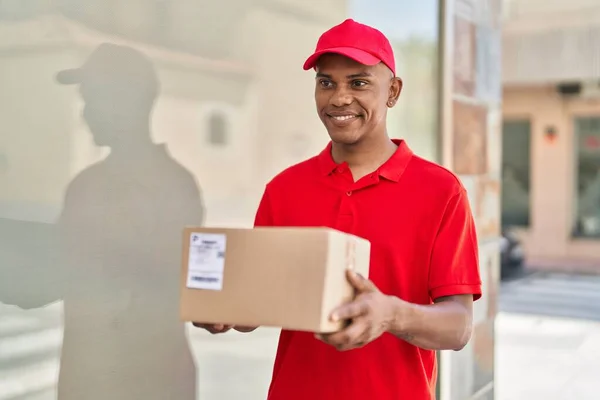 Young Latin Man Delivery Worker Holding Package Street — Stockfoto
